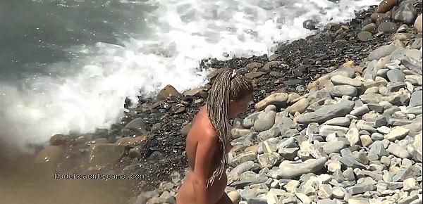  Nudist girls expose bodies at the beach